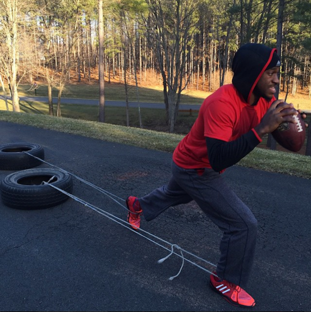 Robert Griffin III pulls Tires attached to his ankles
