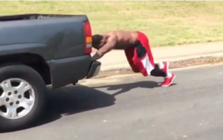 AJ Green and Justin Houston Pushing A Truck