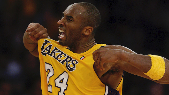 kobe bryant popping out his lakers jersey during a game