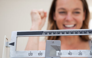 Woman Weighing Herself