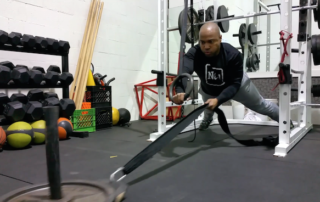 Ring Plank Hold to Sled Pull
