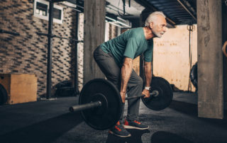 Senior lifting weights - STACK