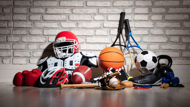 a pile of sports equipment and sports gear from multiple sports