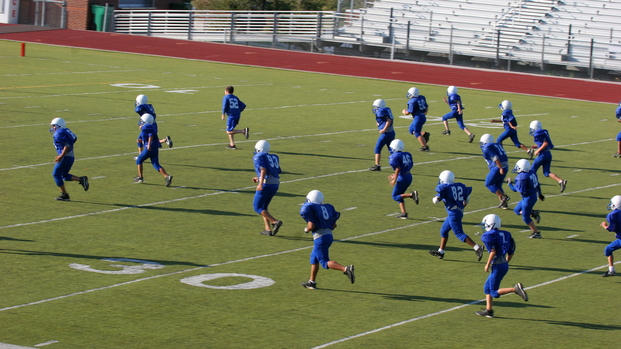A football team running on to the field.