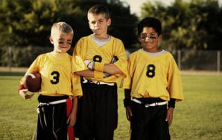 Members of a young male flag football team.